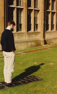 Person standing in the centre casts a shadow which tells the time