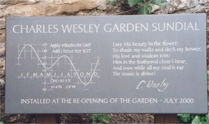 The Sundial plaque by David Brown, showing the equation of time, a verse composed by Charles wesley and a facsimile of Charles Wesley's signature